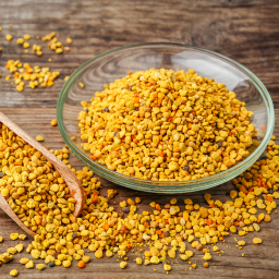 a bowl and spoonful of yellow lentils