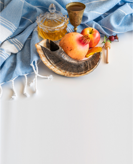 A still-life composition with apples, honey, and a rustic cup on a draped blue cloth