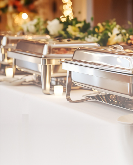 a close-up of a buffet table with food on it